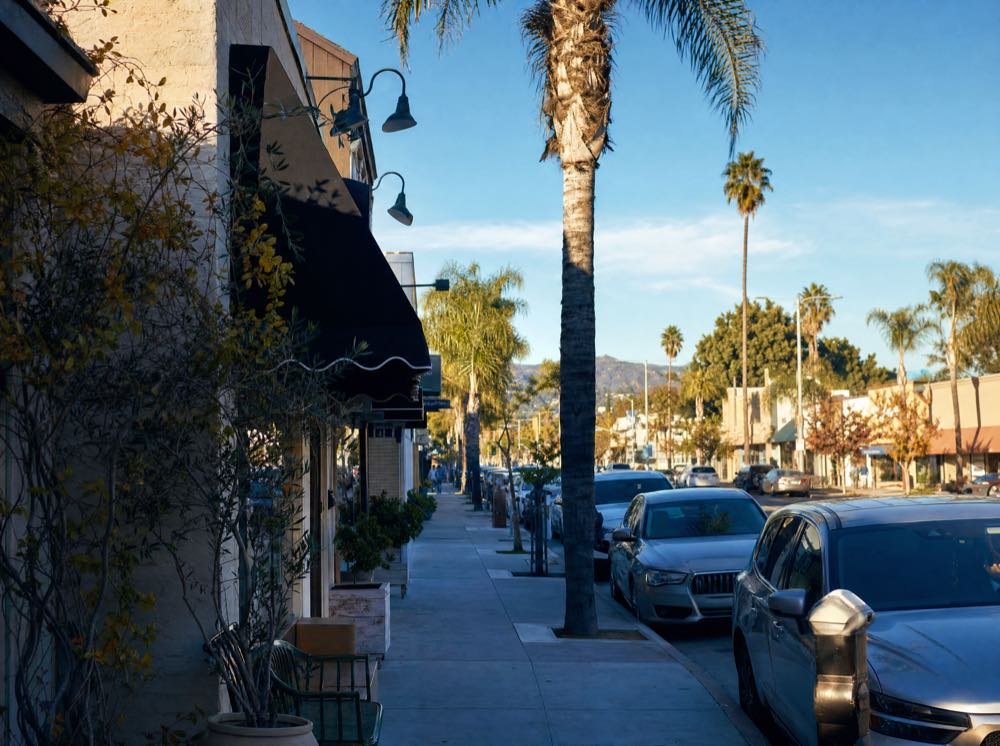 A sunlit neighbourhood commercial street in the San Fernando Valley